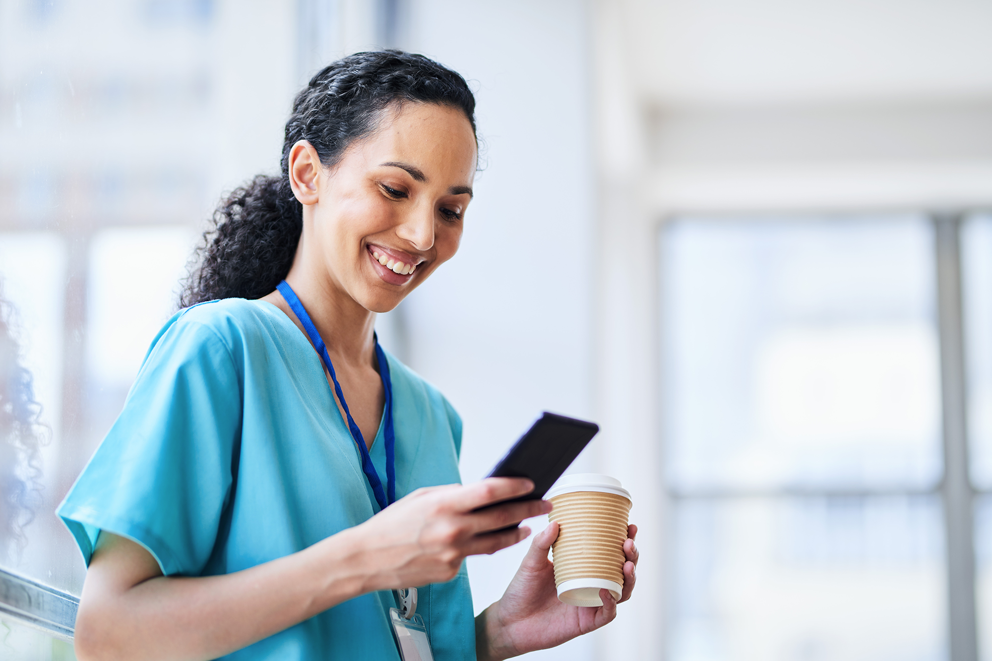 Doctor on phone with coffee